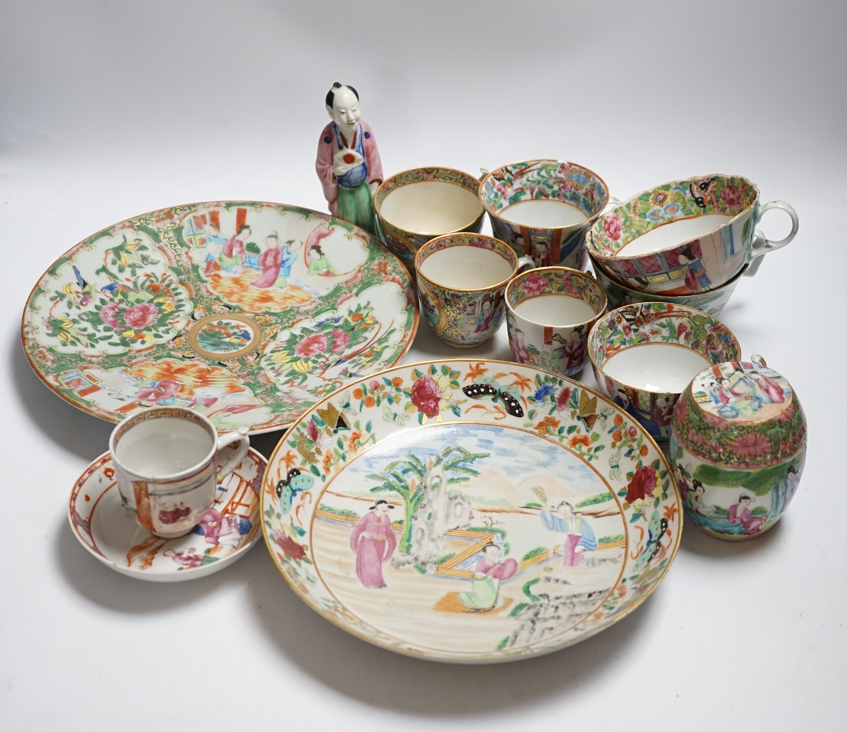Chinese famille rose porcelain including plates, cups, saucers and a figure, 18th and 19th century, largest 27cm diameter